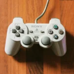 Playstation white controller on desk