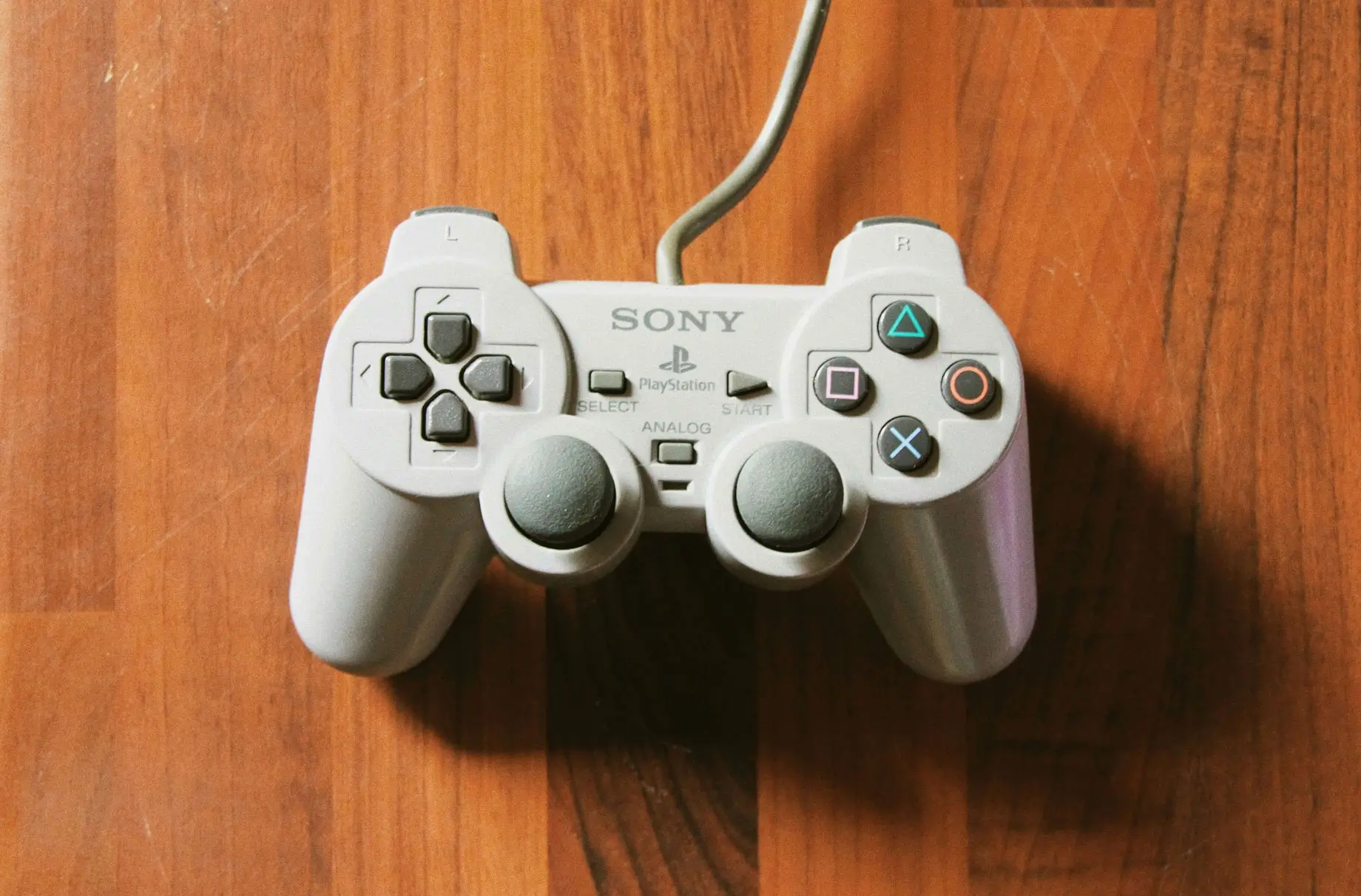 Playstation white controller on desk